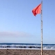 Red flag on beach.