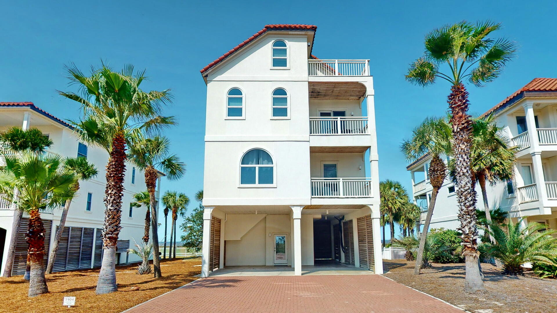 st. george island vacation rental exterior with palm trees